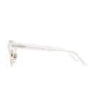Side view of Kuboraum N6 eyeglasses with translucent white arms and gold-colored hinges, set against a plain white background.