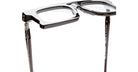 Close-up of Kuboraum D76 black thick-rimmed eyeglasses, featuring metal temple accents, front angle.