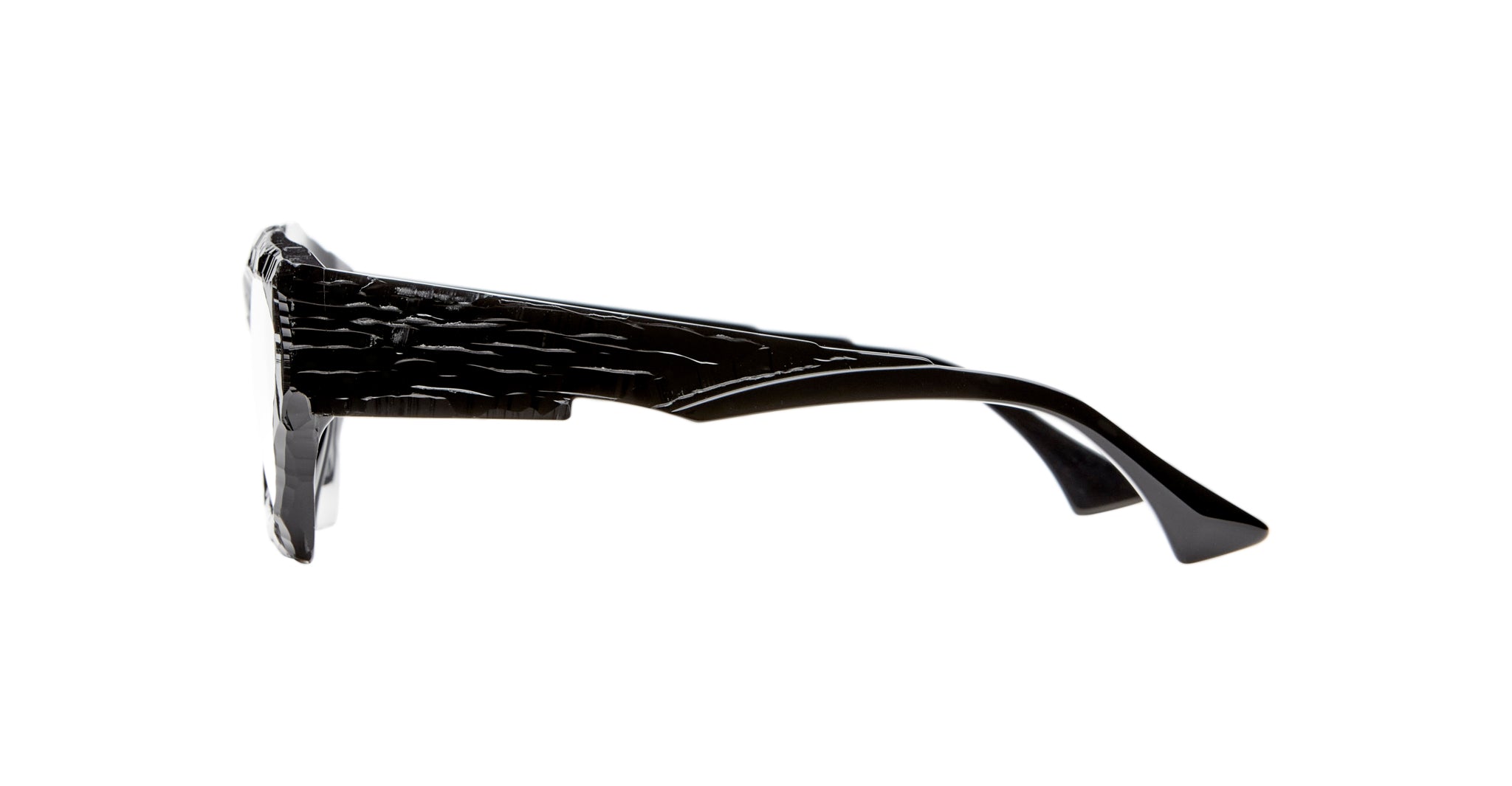 Side view of Kuboraum F4 black sunglasses featuring a textured, wavy pattern on the arms, displayed on a plain white background.