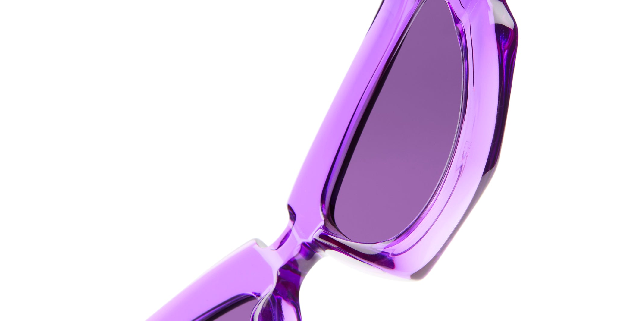 Close-up of KUBORAUM Kuboraum F5 sunglasses showing bold purple geometric frames, front angle view.