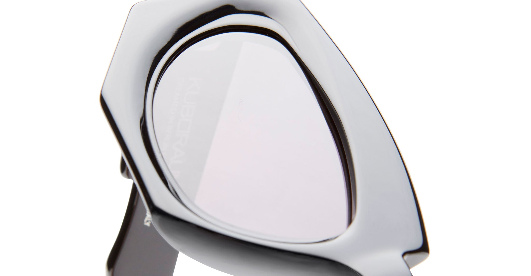 Close-up of Kuboraum F5 eyeglasses by KUBORAUM, featuring a black geometric frame and clear lenses, front-facing view.