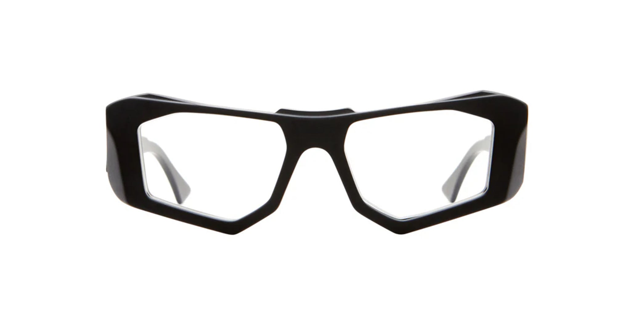 Black angular eyeglass frames with thick rims and clear lenses, shown on a white background. The design features sharp, geometric lines and a bold, modern style.