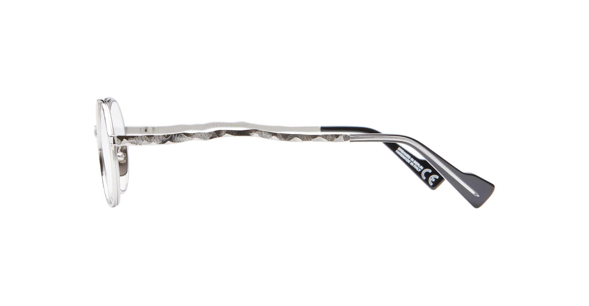 Side view of Kuboraum H11 eyeglasses featuring round silver frames and textured, wavy metal arms with black earpieces, displayed against a white background.