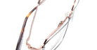 Close-up of Kuboraum H15 eyeglasses featuring thin rose gold metal frames and tortoiseshell-patterned arms, displayed on a white background.