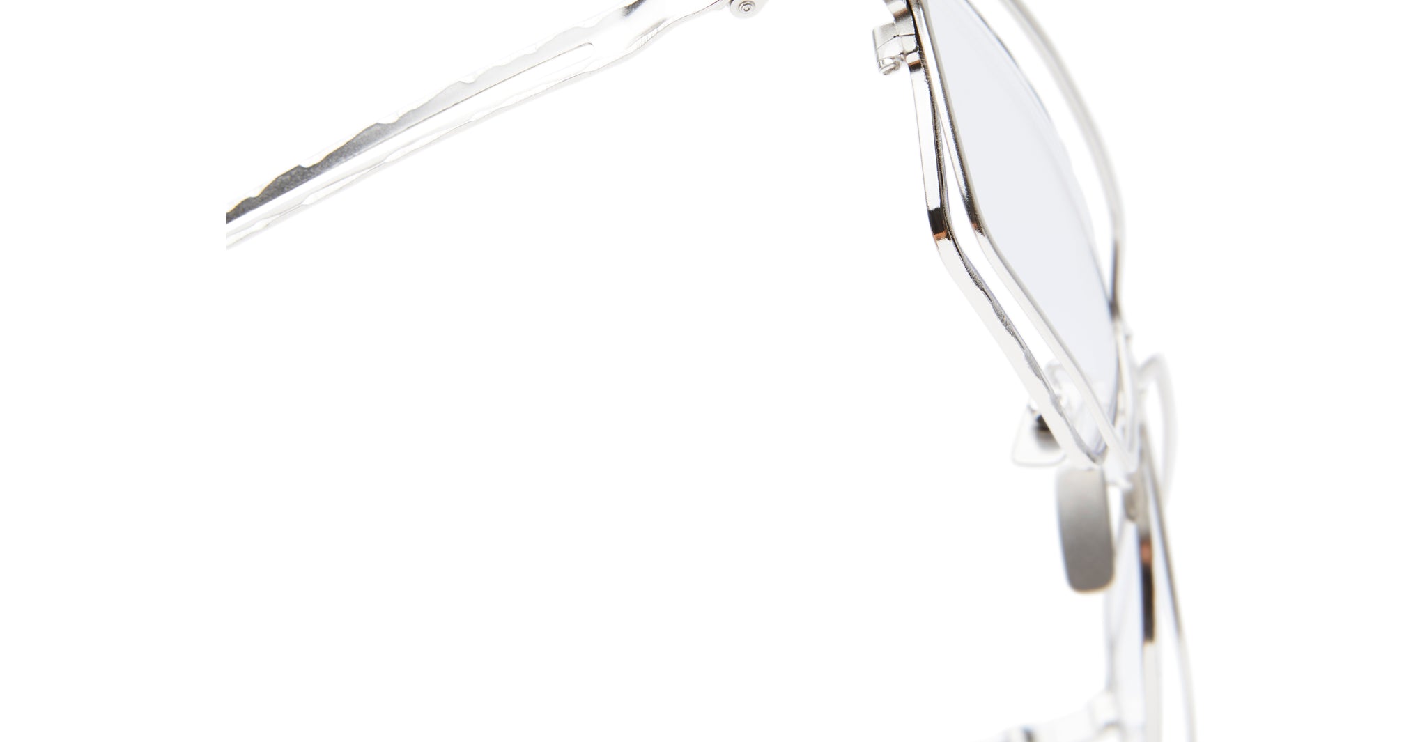 Close-up side view of Kuboraum H15 silver metal eyeglass frames with clear lenses, focusing on the temple and hinge, set against a white background.