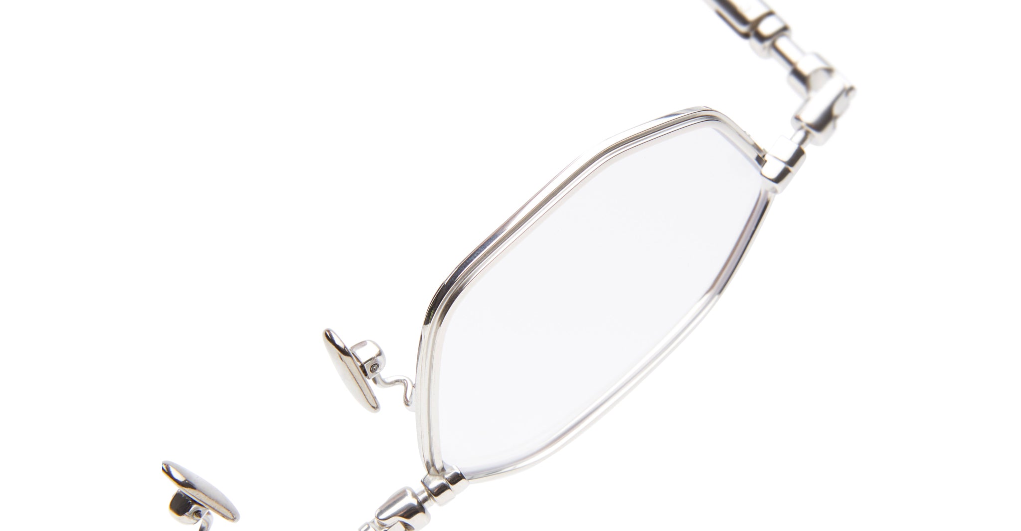 Close-up of KUBORAUM Kuboraum H66 eyeglasses showing lens, frame, nose pad, and hinge detail from a side angle.
