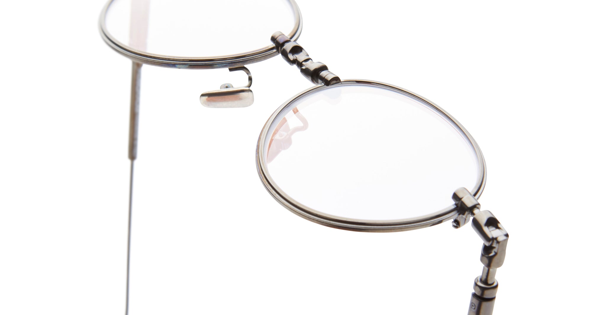 Close-up of Kuboraum H67 metal-frame eyeglasses with clear lenses, front angle view.
