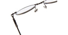Close-up view of KUBORAUM H67 eyeglasses showing thin metal rims, hinge detail, and adjustable nose pads.
