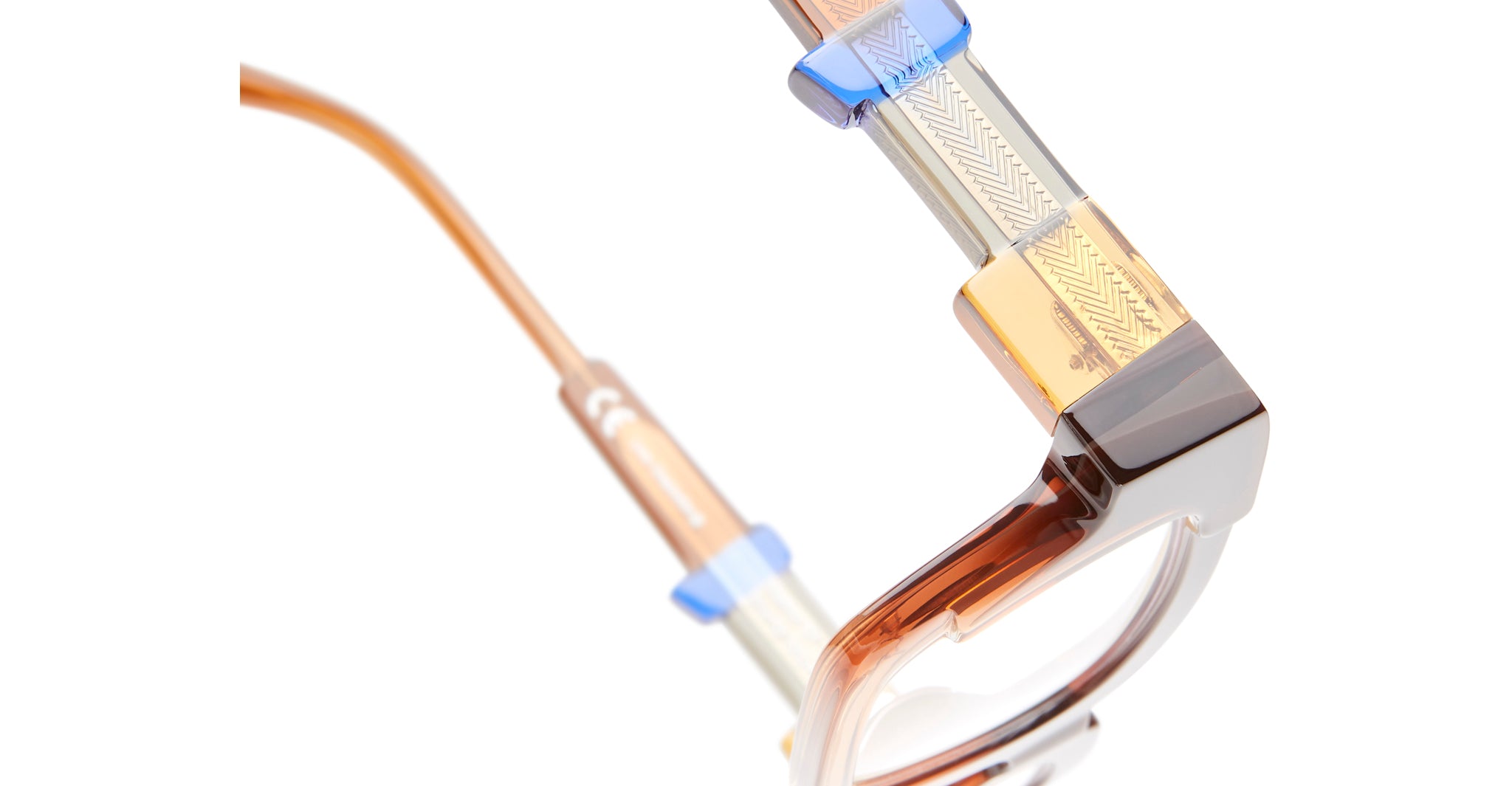 KUBORAUM Kuboraum I01 eyeglasses, close-up view, featuring transparent brown and blue geometric frames.