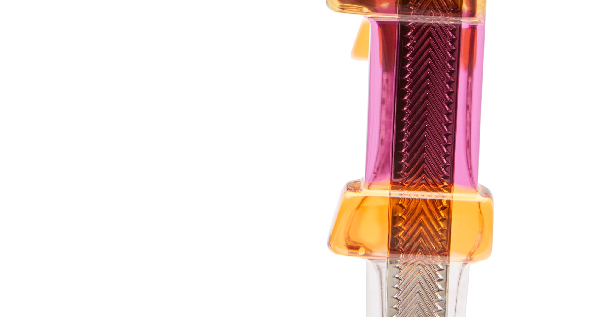 Close-up of KUBORAUM Kuboraum I01 eyeglasses, transparent plastic frame with zigzag texture, shown from the front angle.