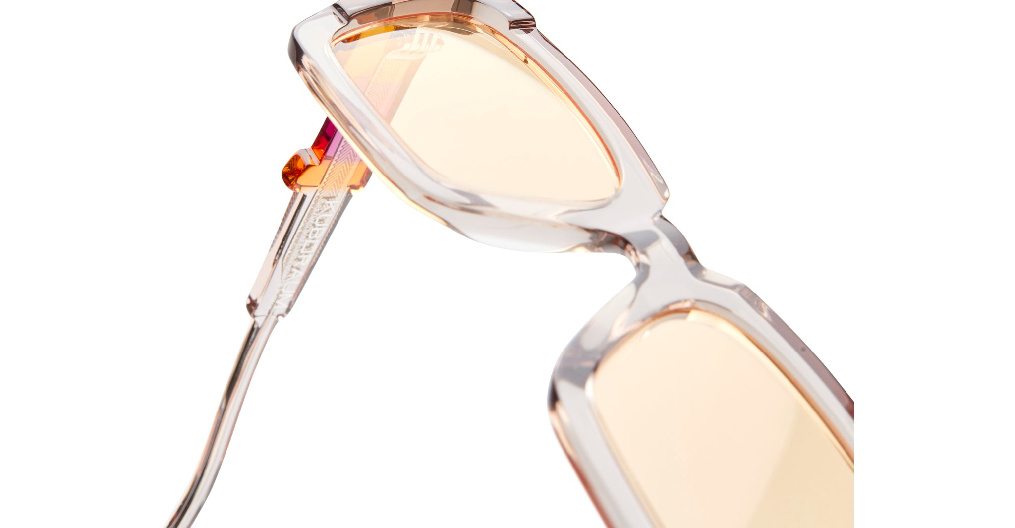 KUBORAUM I01 eyeglasses: transparent square frames, metallic arms, light pink-tinted lenses, displayed at an angle.