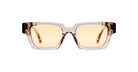 Kuboraum I01 eyeglasses by KUBORAUM, front view, rectangular translucent brown frame with amber blue-light-filter lenses.