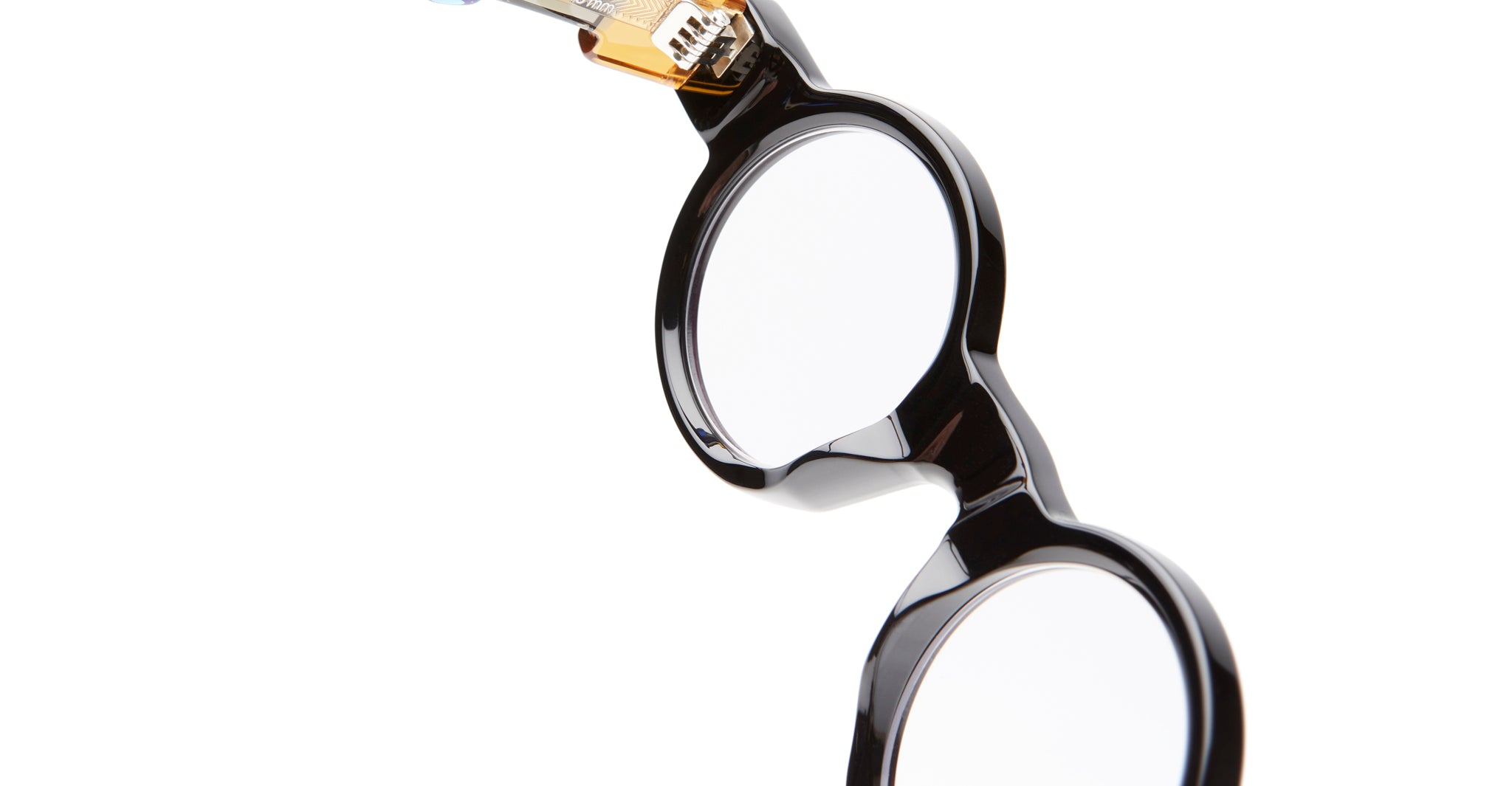 Close-up of KUBORAUM I02 round black eyeglasses frames with clear lenses, front view, brand and model visible.