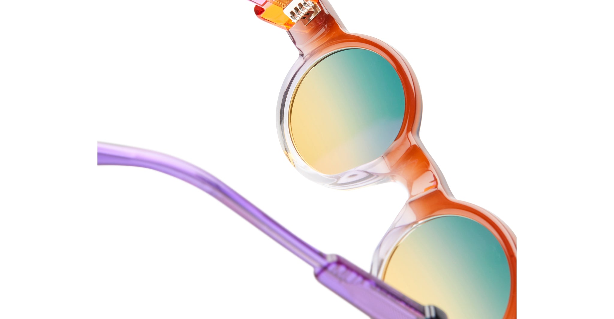 Close-up of Kuboraum I02 round sunglasses with orange frames and gradient lenses, shown with a purple arm.