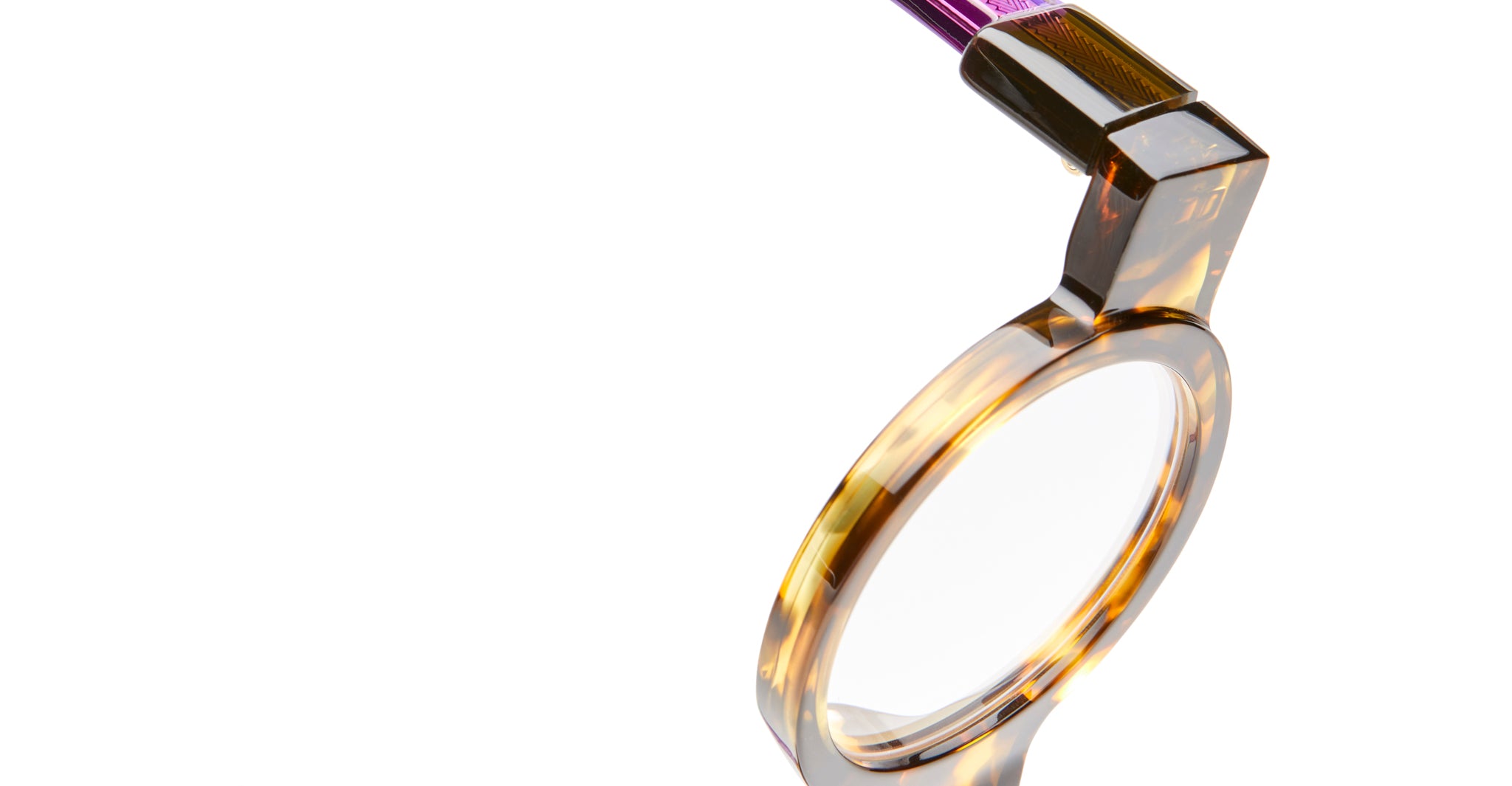 Close-up of KUBORAUM I02 eyeglasses showing amber frame and purple handle, with brand and model details clearly visible.