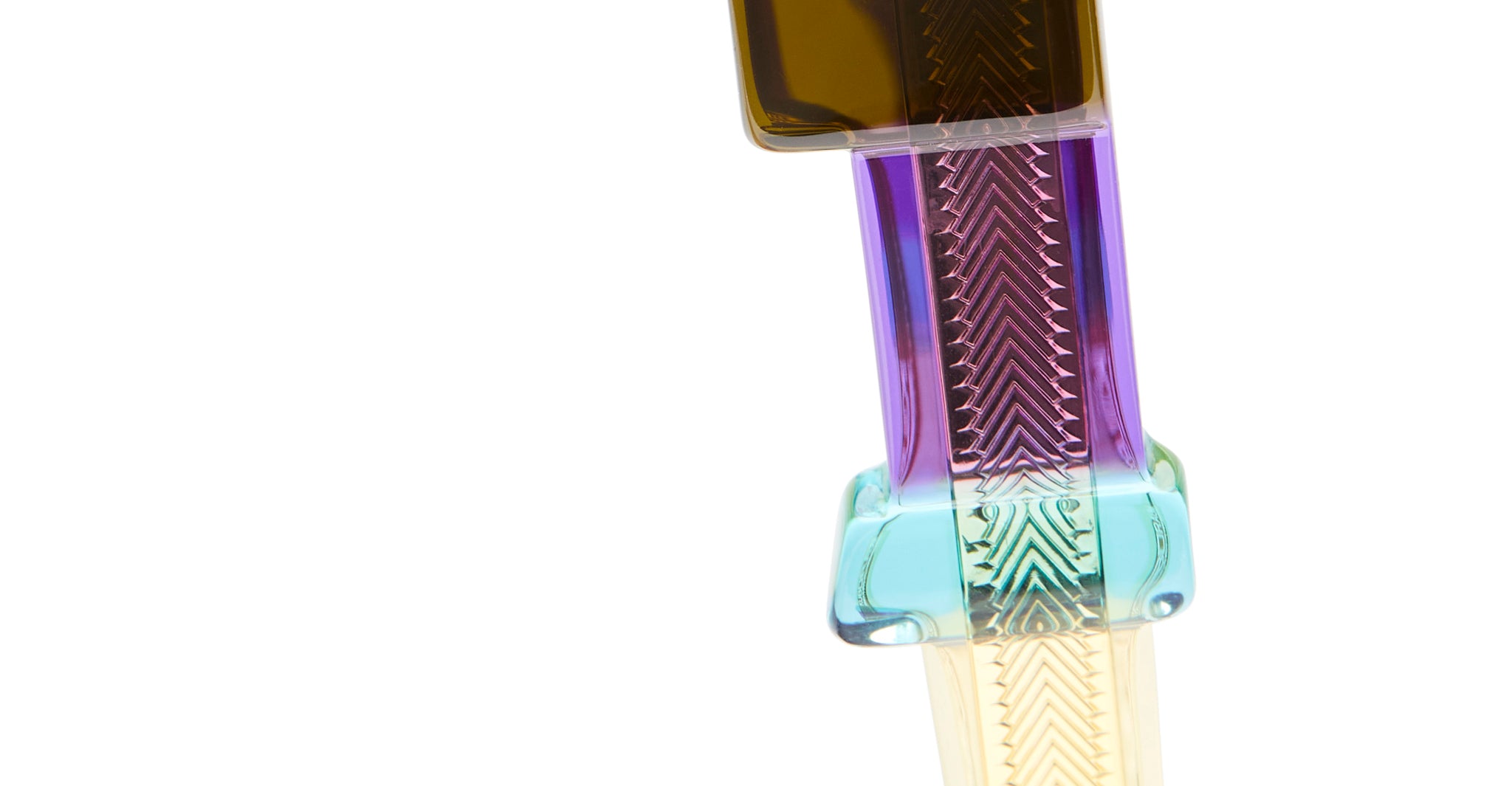 Close-up of Kuboraum I02 eyeglasses by KUBORAUM, featuring translucent frames with textured zigzag patterns, front view.