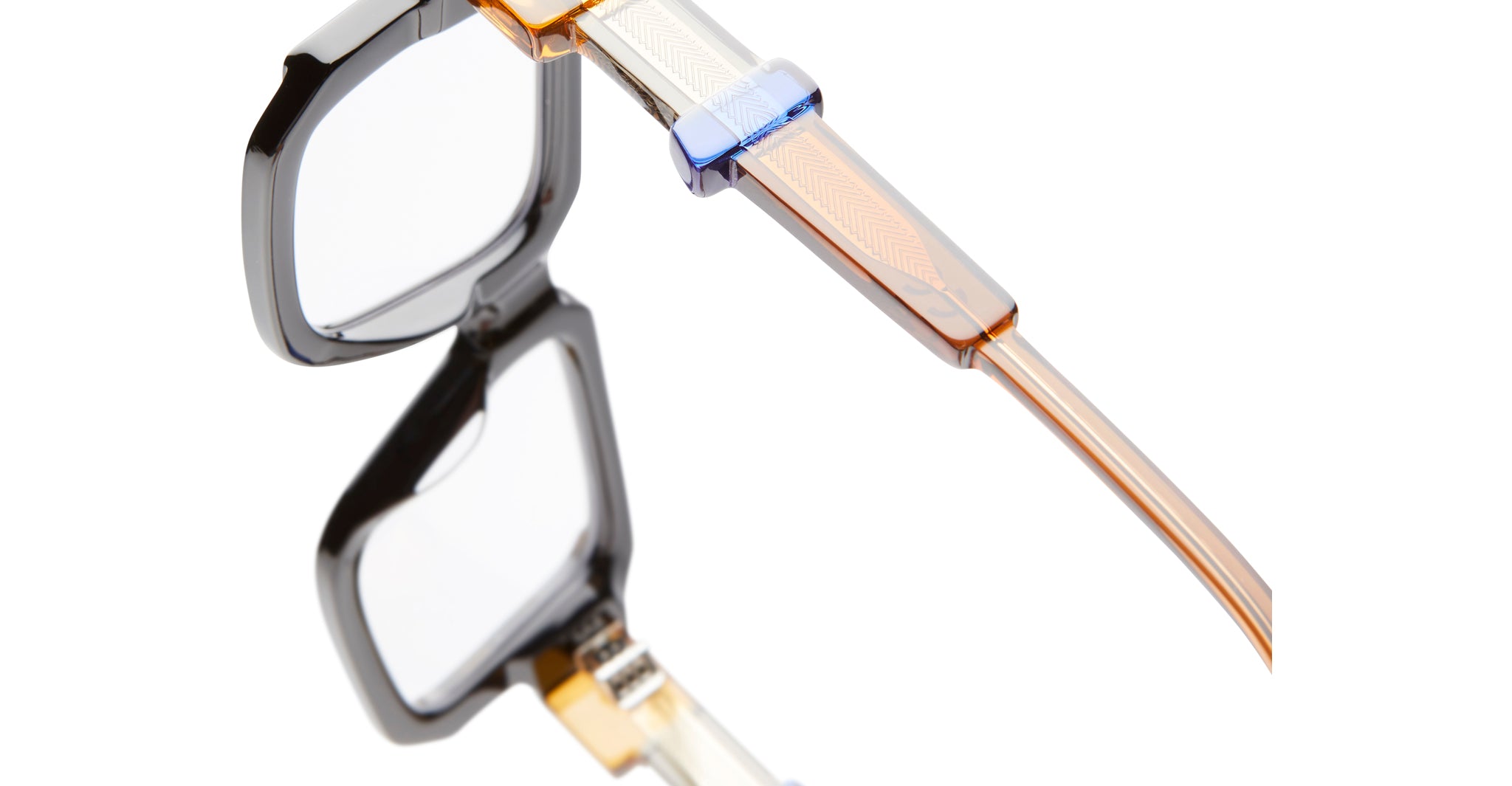 Close-up of KUBORAUM Kuboraum I03 eyeglasses, geometric frame design, translucent blue temples, viewed from the front angle.