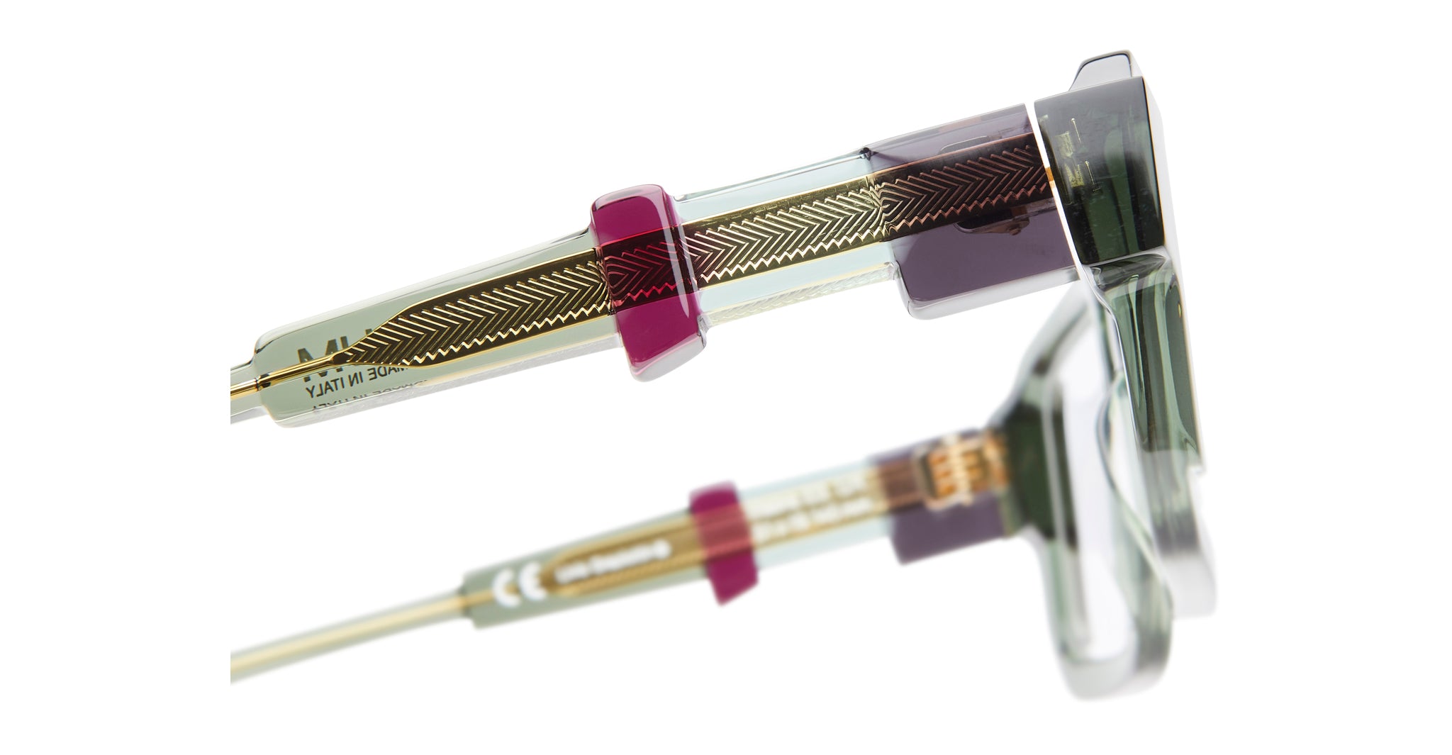 Close-up of KUBORAUM I03 eyeglasses showing transparent frame and labeled parts, viewed from the front.