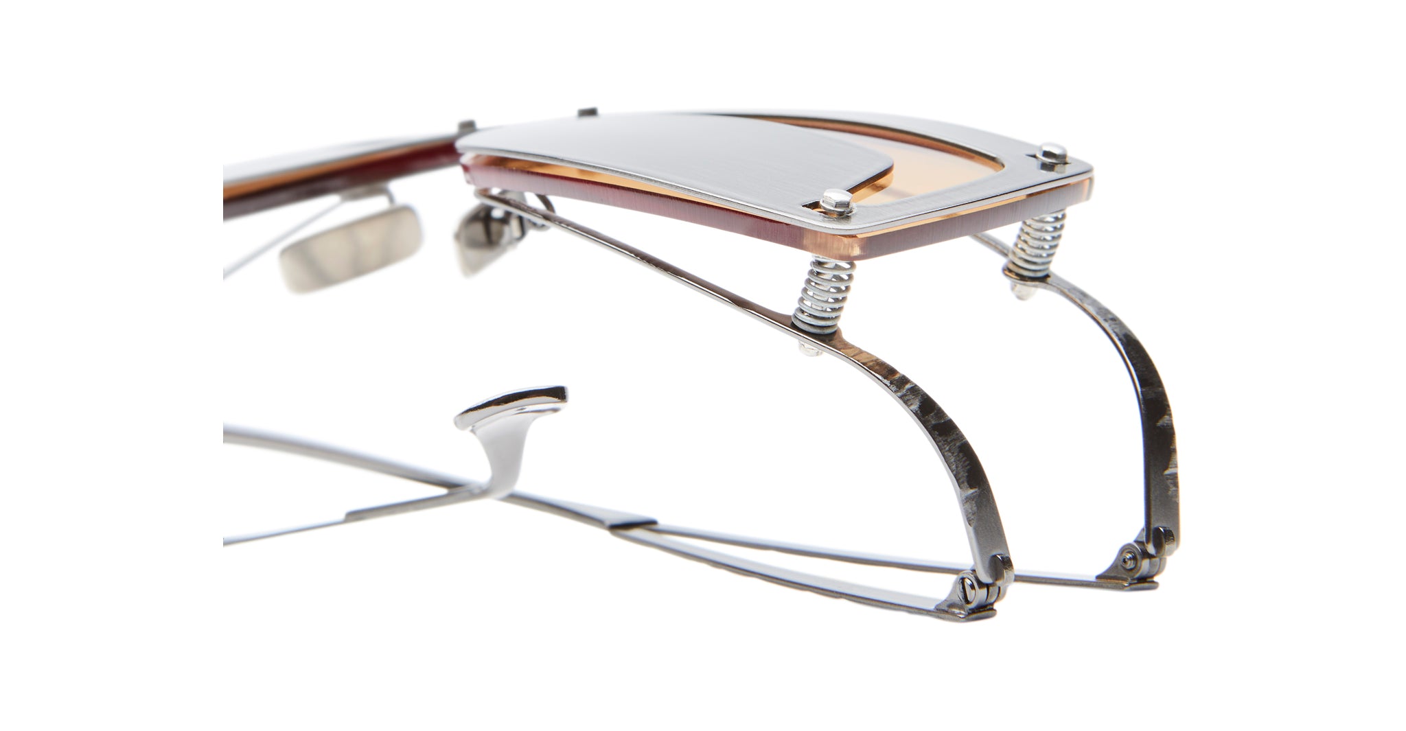 Close-up of Kuboraum I50 eyeglasses highlighting the intricate hinge with metal springs and layered temple design, set against a white background.