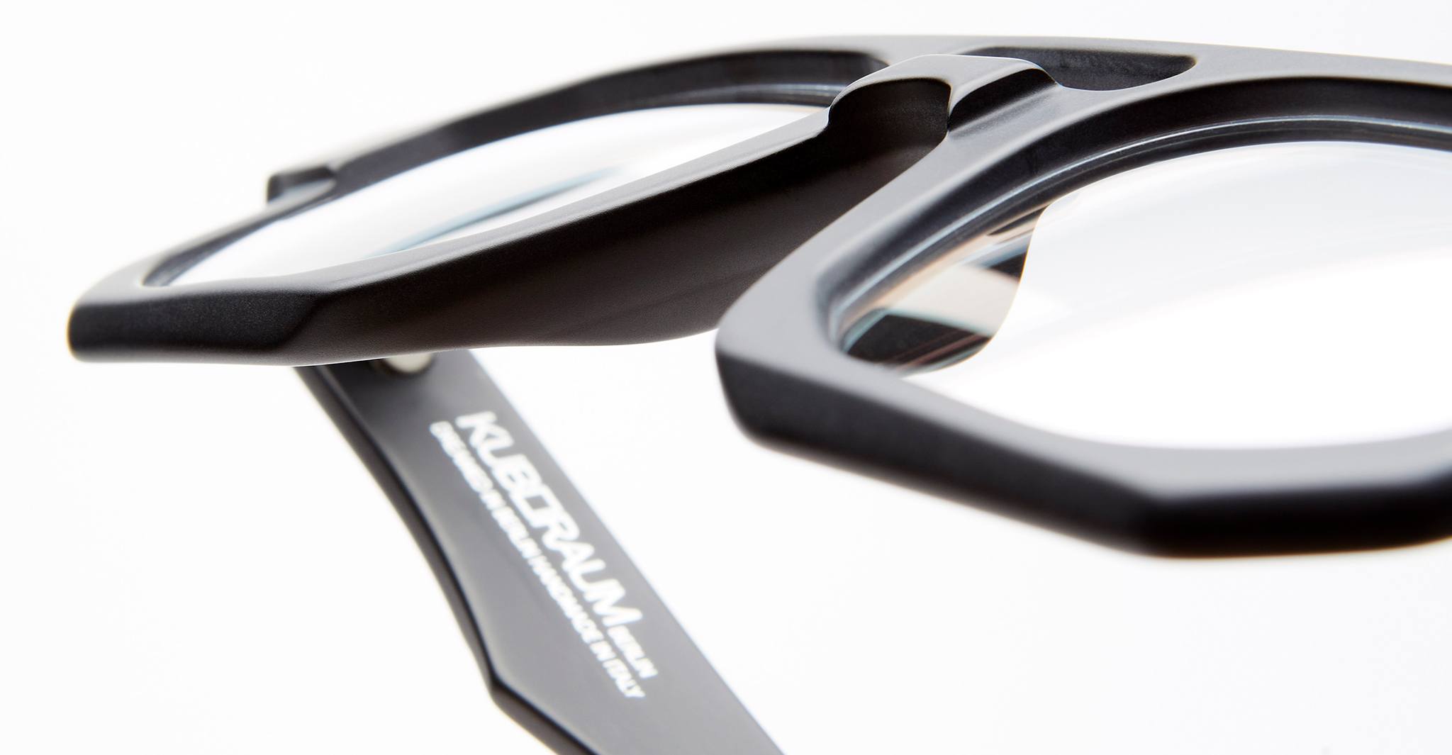 Kuboraum K33 BM optical frame in Black Matte with clear lenses, close-up bridge and lens image