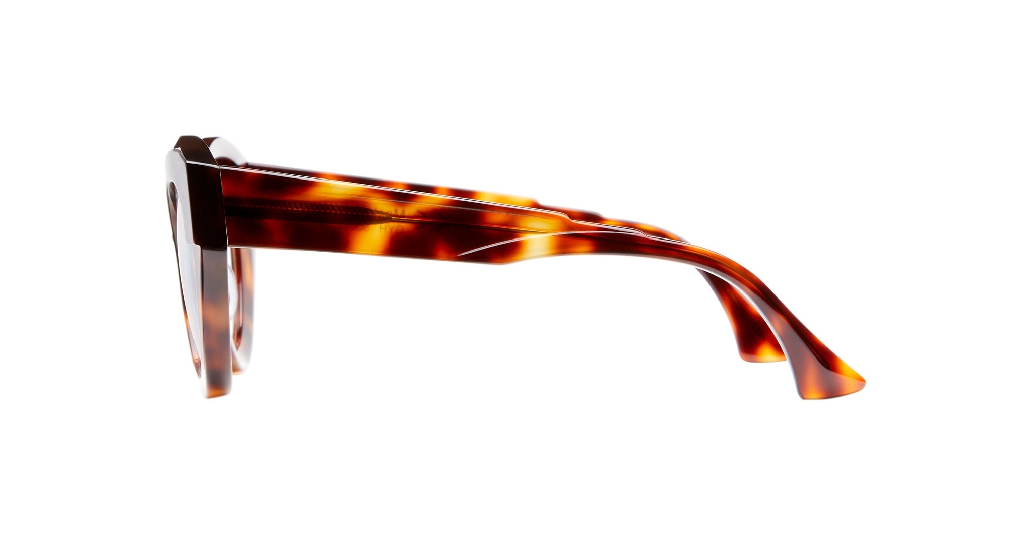 Side view of Kuboraum K35 eyeglasses featuring thick, tortoiseshell-patterned plastic frames and wide temples, set against a white background.