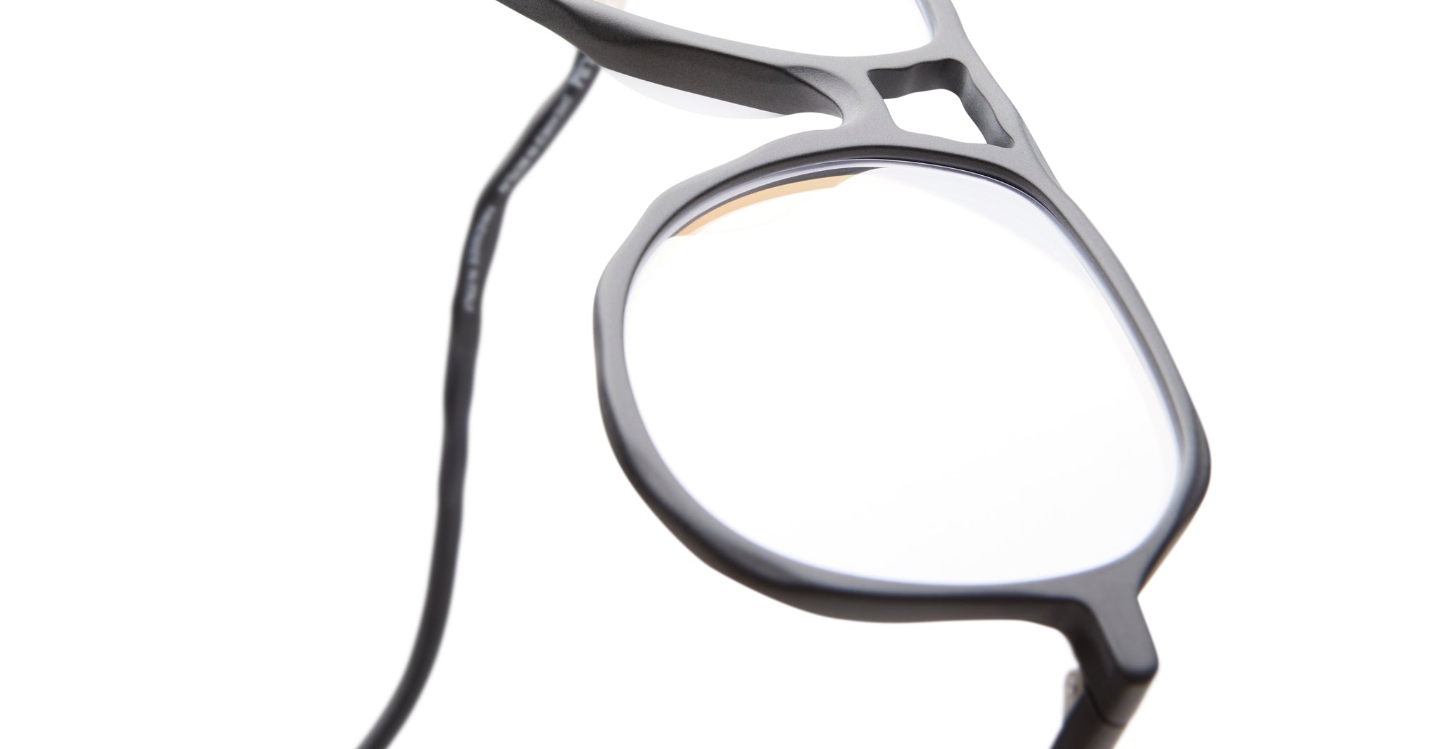 Close-up of Kuboraum L10 black geometric eyeglasses, front view, showing frame shape and design details.