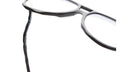 Close-up of KUBORAUM Kuboraum L10 black acetate eyeglasses showing wavy temple design, front and side angle.