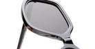 Close-up of KUBORAUM Kuboraum P20 black sunglasses, showing the corner and tinted lenses from a side angle.