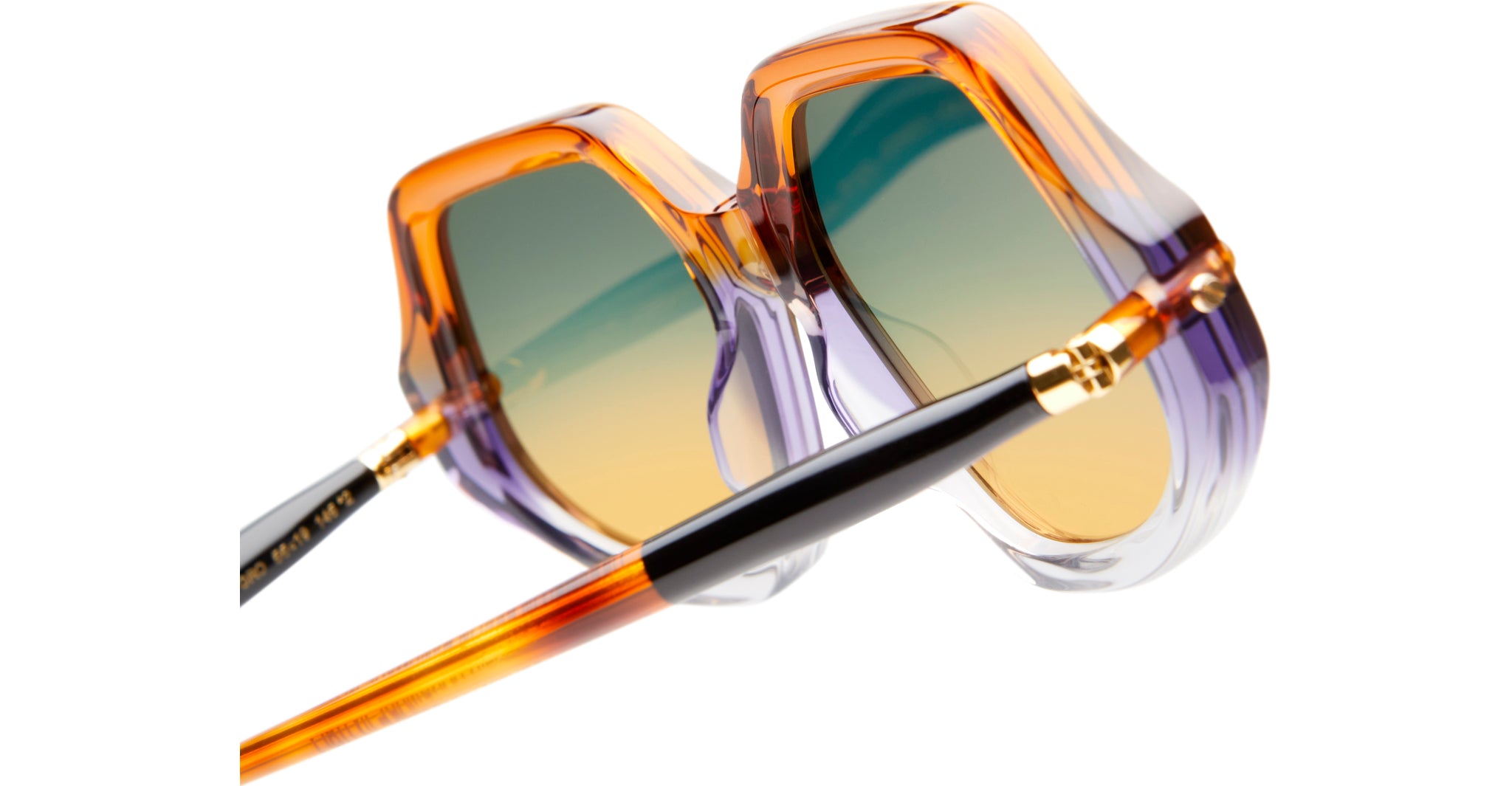 Close-up of KUBORAUM P20 oversized sunglasses with orange, purple, and clear gradient frames. Brand and model visible.