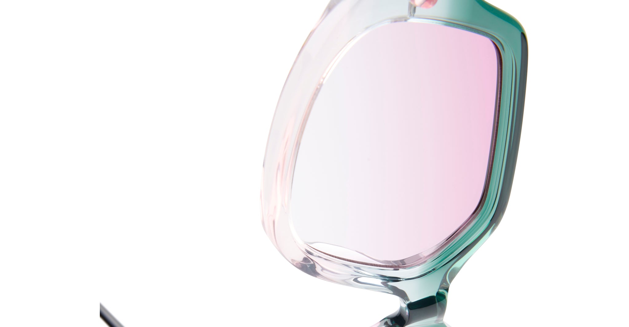 Close-up of KUBORAUM P20 eyeglasses, featuring a translucent frame and pink-tinted lenses, viewed from the front.