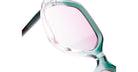 Close-up of Kuboraum P20 sunglasses by KUBORAUM, showing translucent frames and pink-tinted lenses, front view.