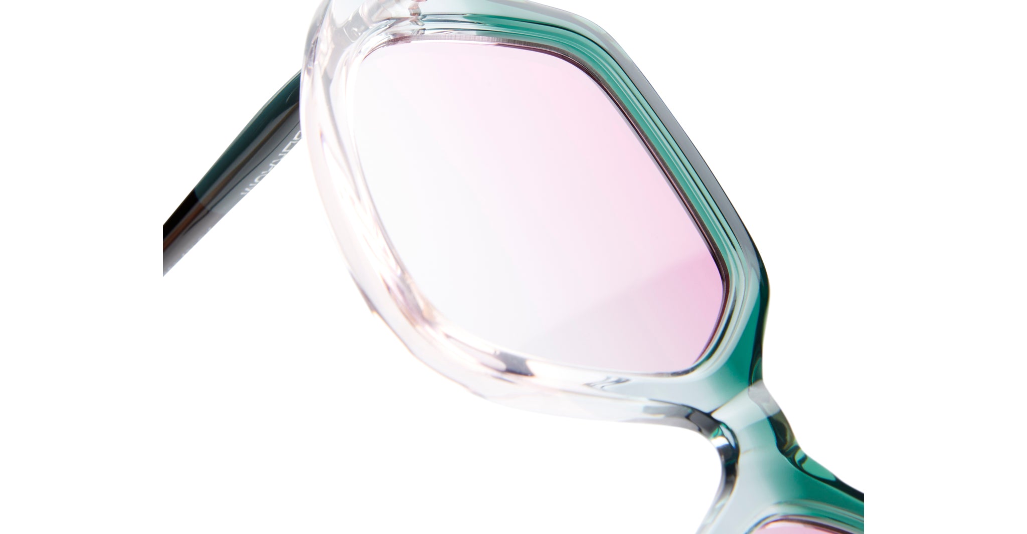 Close-up of Kuboraum P20 sunglasses by KUBORAUM, showing translucent frames and pink-tinted lenses, front view.