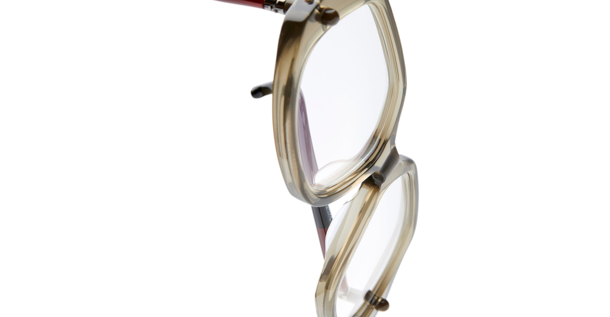 A side close-up of the Kuboraum P20 eyeglasses in beige translucent acetate with clear lenses, set against a white background.