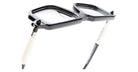A close-up of Kuboraum P23 black and white eyeglasses featuring a unique flip-up lens design, set against a white background.