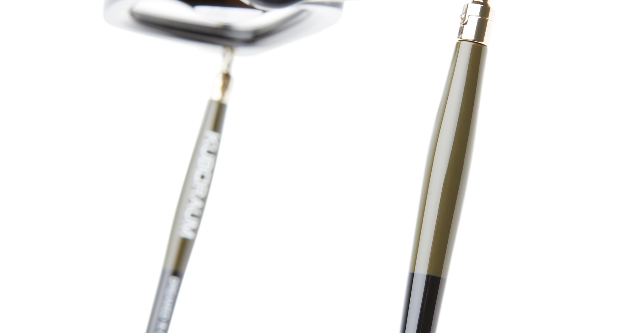 Close-up of the Kuboraum P25 metallic golf putter head and shaft, both featuring a smooth, reflective finish, set against a white background. The image highlights the detailed texture and craftsmanship of the club.