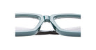 Close-up of the bridge and lenses of Kuboraum P25 teal rectangular eyeglass frames, highlighting their glossy finish and clear prescription lenses against a white background.