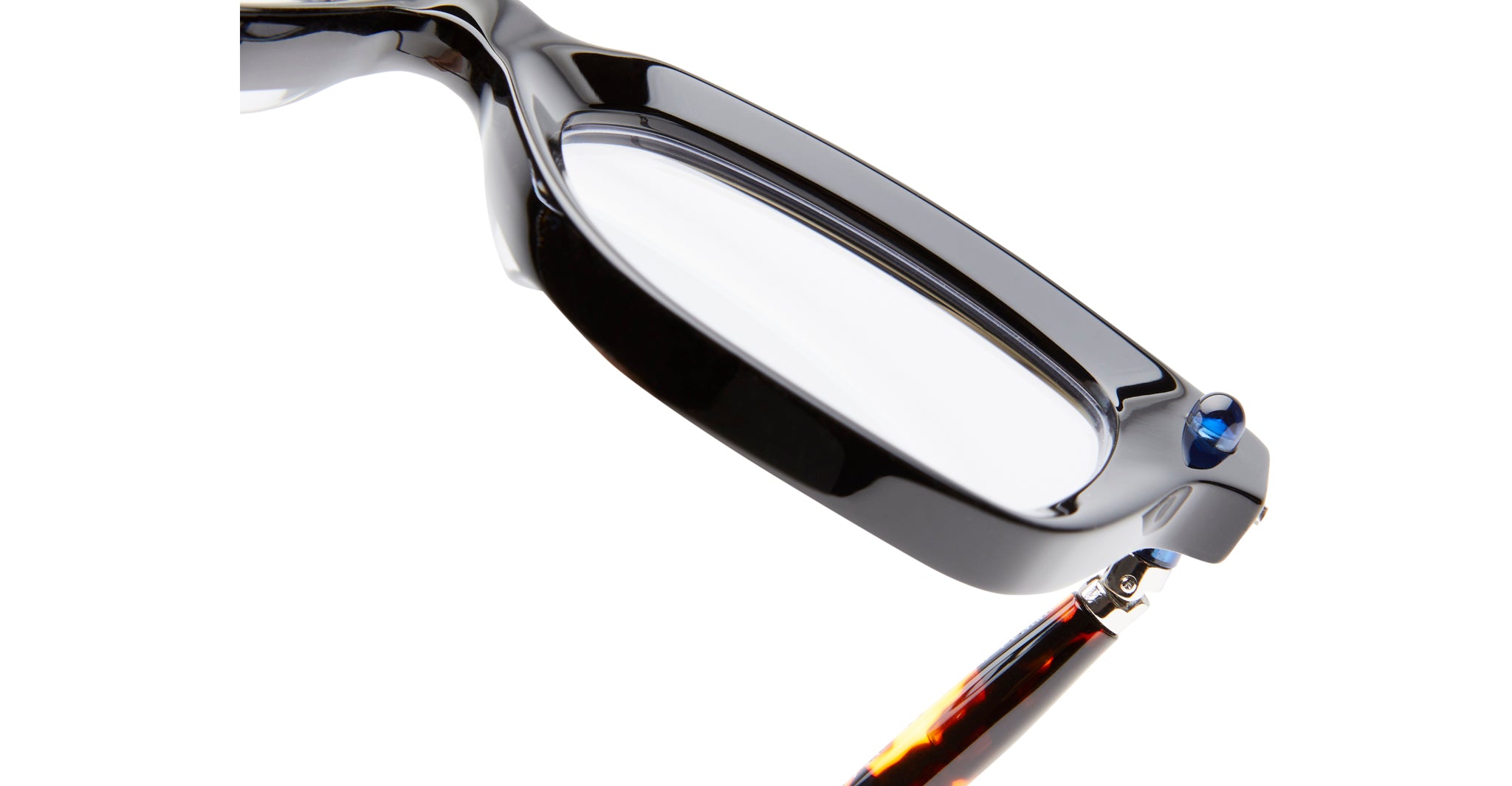Close-up of KUBORAUM P28 black eyeglasses frame, clear lenses, bold blue hinge accent, frontal view.