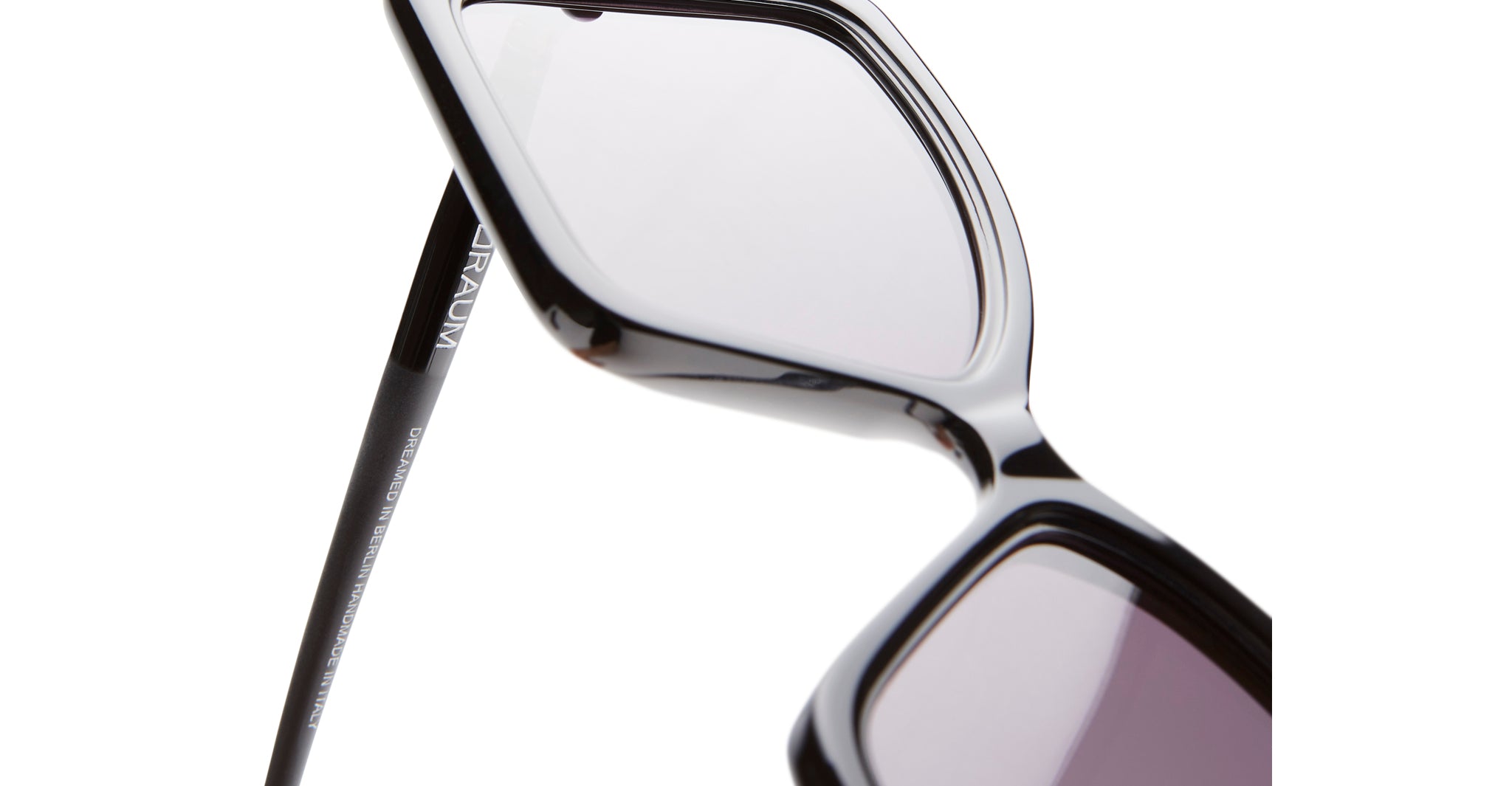 Close-up of black rectangular KUBORAUM P30 sunglasses with light-tinted lenses, showing bold logo on the temple.
