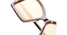 Close-up of Kuboraum P30 tortoiseshell square sunglasses with amber lenses, showing KUBORAUM logo on the temple.