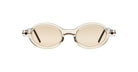 The Kuboraum P6 sunglasses feature round, beige-tinted lenses with clear, thick frames and dark temple arms, showcased on a white background.