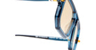 Close-up of Kuboraum P8 blue-framed eyeglasses with tinted lenses, featuring a detailed side view of the frame and temples against a white background.