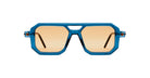 The Kuboraum P8 sunglasses feature thick blue geometric frames and light brown lenses, shown from the front against a white background.