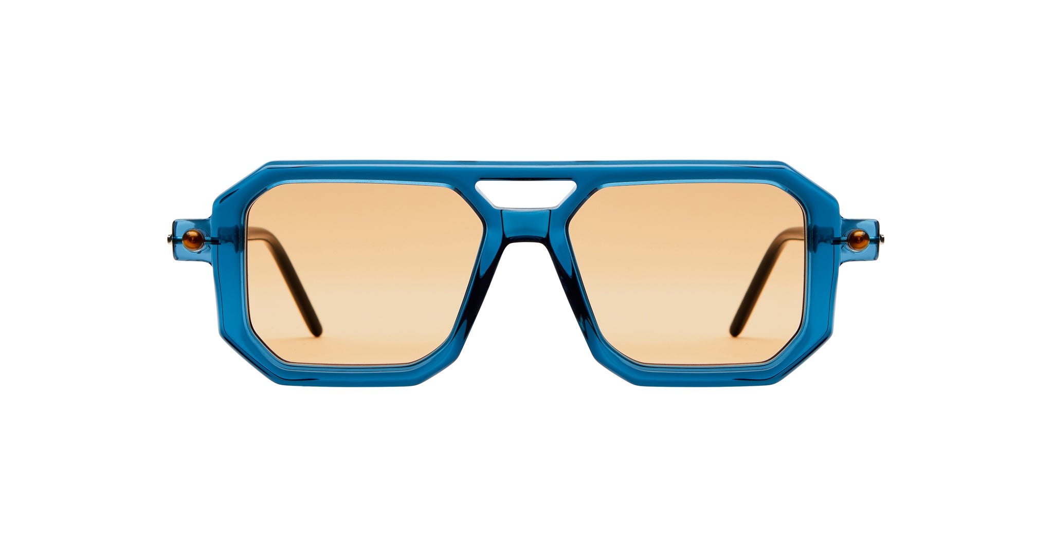 The Kuboraum P8 sunglasses feature thick blue geometric frames and light brown lenses, shown from the front against a white background.