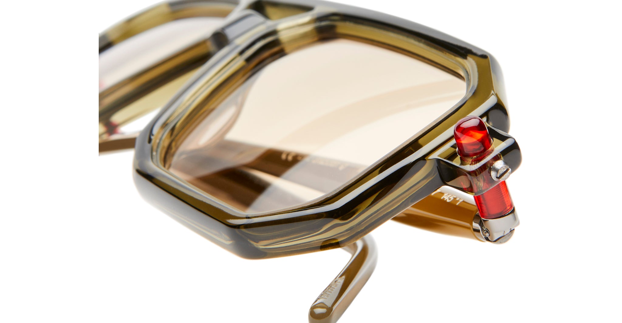 Left Lens Detail View of Kuboraum P8 Sunglass in Color GRG Military Green