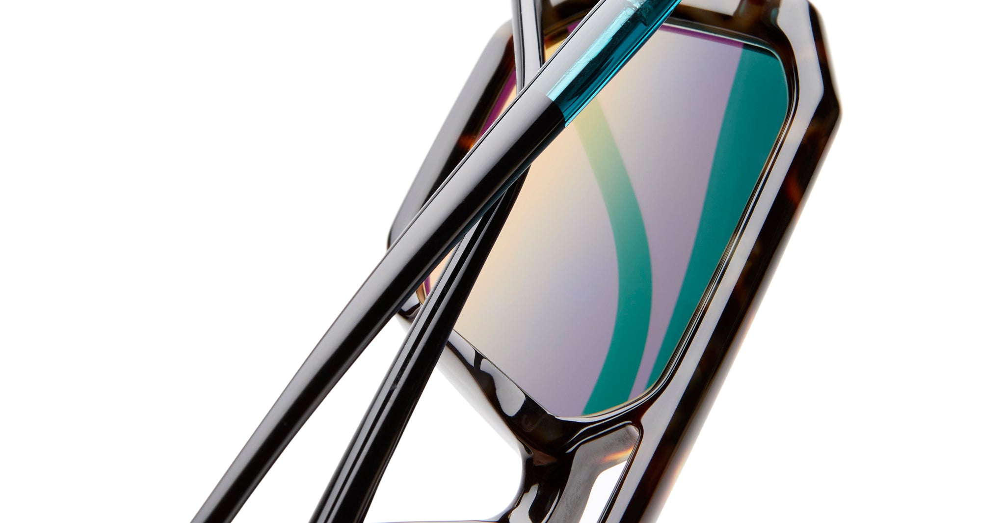 Close-up of KUBORAUM P8 sunglasses showing multicolored lenses and glossy dark frames, photographed from the front angle.