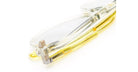 A close-up of the Kuboraum Q4 translucent yellow eyeglasses on a white surface, highlighting the detailed hinge, frame, and temples.