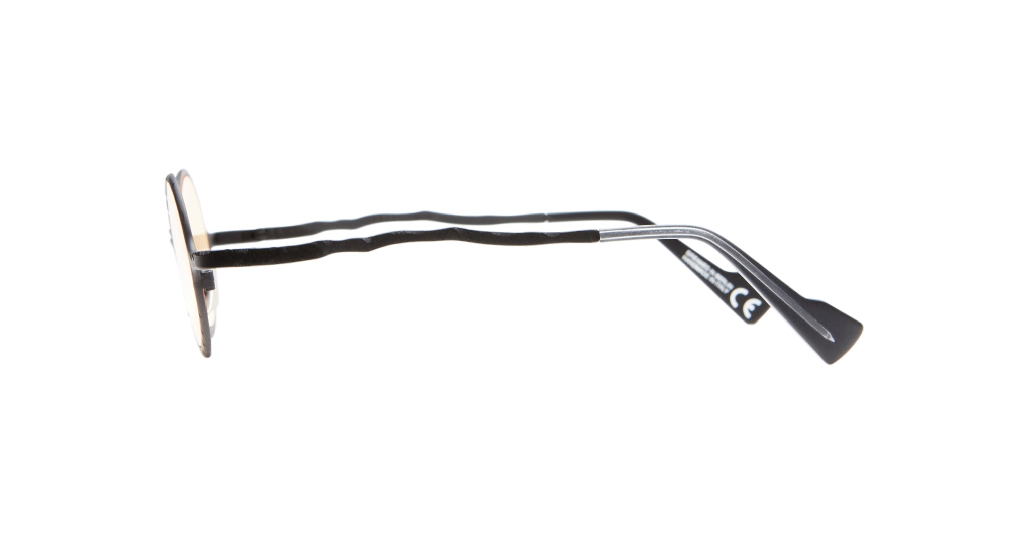 Side view of KUBORAUM Z17 round metal eyeglasses with black wavy temples, showing the frame design and details.