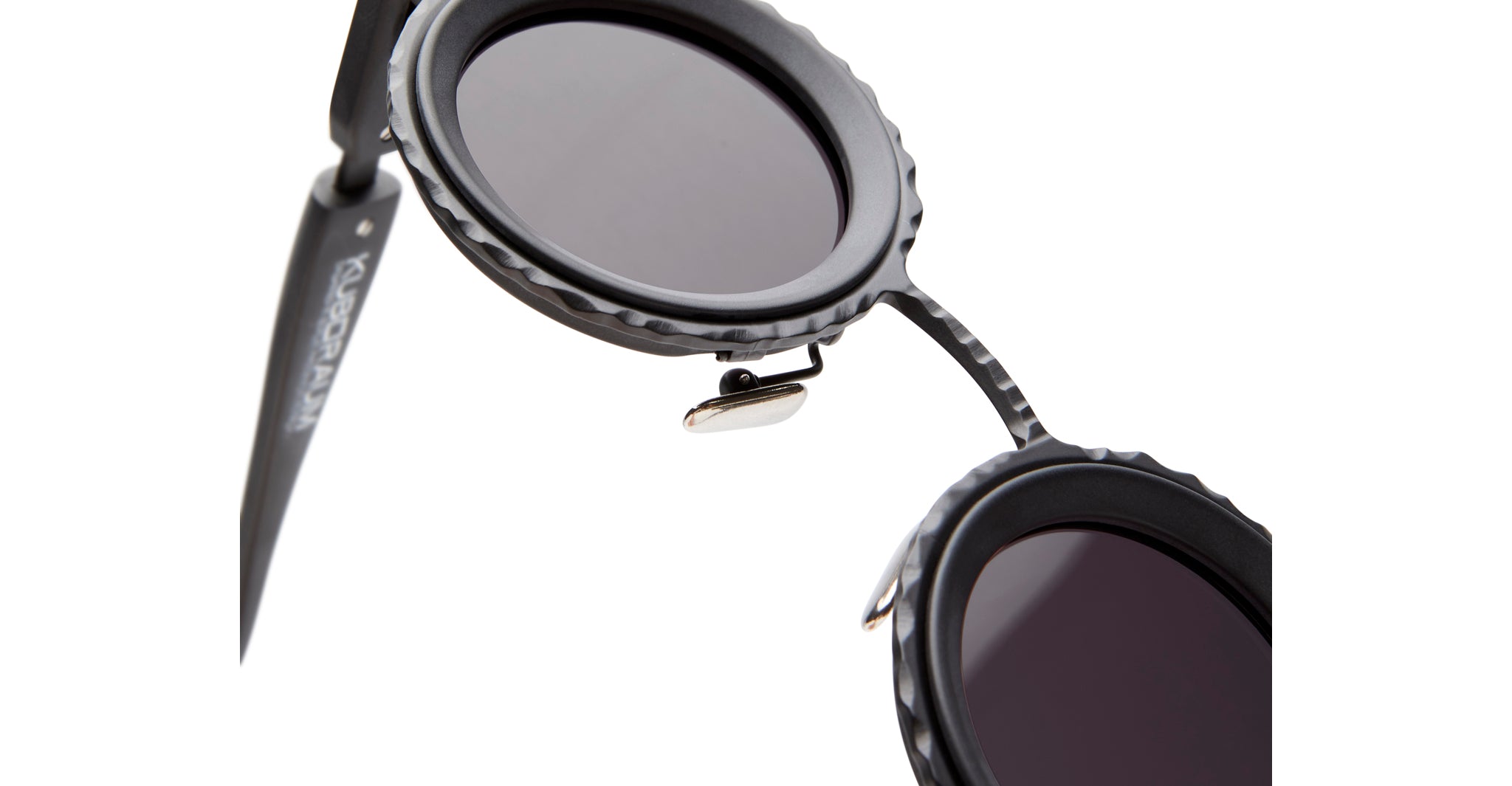 Close-up of KUBORAUM Z3 black round sunglasses featuring textured frame and dark lenses, viewed from the front.