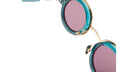 Close-up of KUBORAUM Z3 round sunglasses showing blue frames, gold accents, and purple gradient lenses.