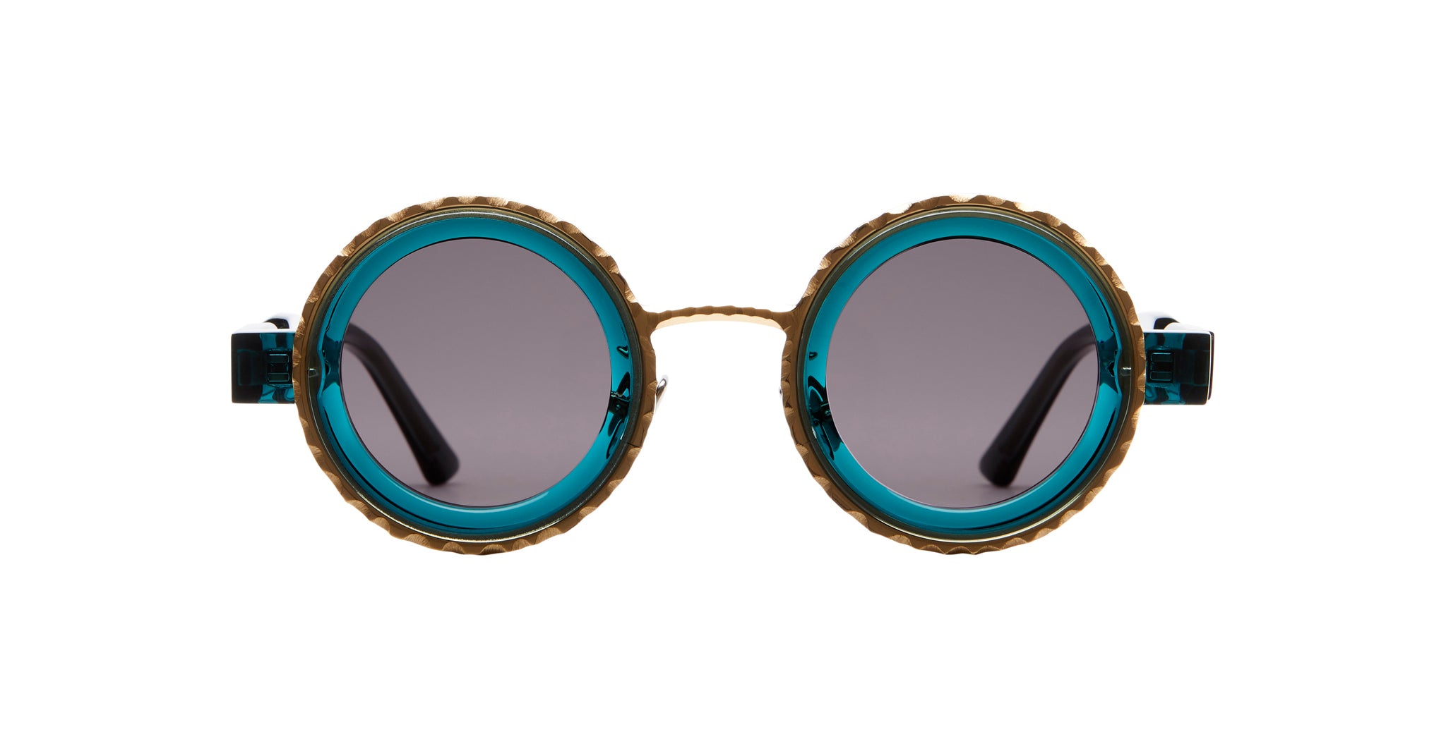 Kuboraum Z3 sunglasses by KUBORAUM with round teal frames, gold trim, and dark polarized lenses, shown from the front.